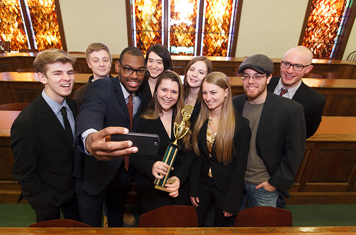 Members of the winning mock-trial team commemorate the moment.