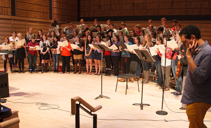 In 2013, composer Mohammed Fairouz (far right) worked with student vocalists who were preparing to perform his 2012 oratorio.