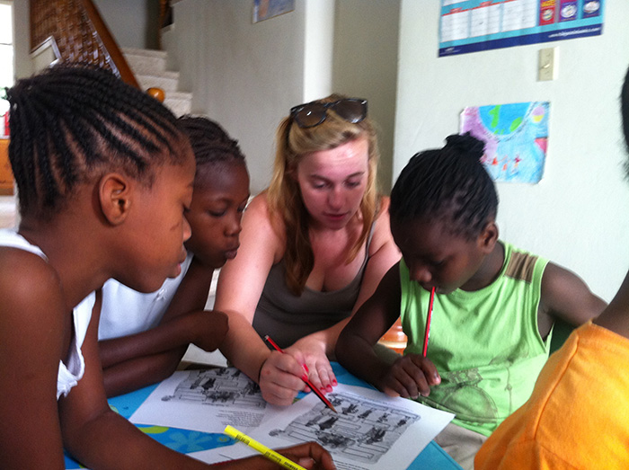 Molly DiLeonardi '15 and a few of her young pupils. Photo by Dominique Pierre, program director of Children of Haiti Project.