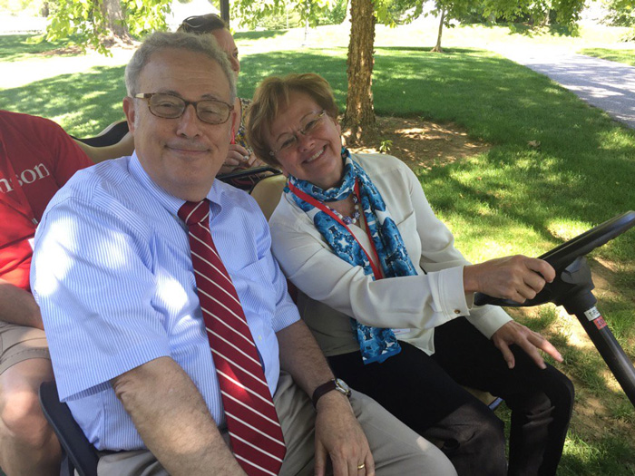 Interim President Neil Weissman and President-elect Margee Ensign pose for a shot in one of the many golf carts staff used to get around campus during Alumni Weekend. Photo by Carl Socolow '77.