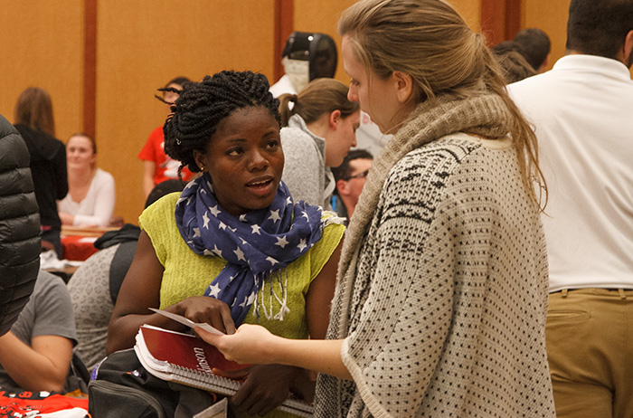 Students find others with like interests at the spring activities fair. Photo by Carl Socolow '77.