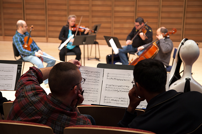 Student composers look on as the Amernet Quartet performs their works as part of their on-campus residency. Photo by Carl Socolow '77.