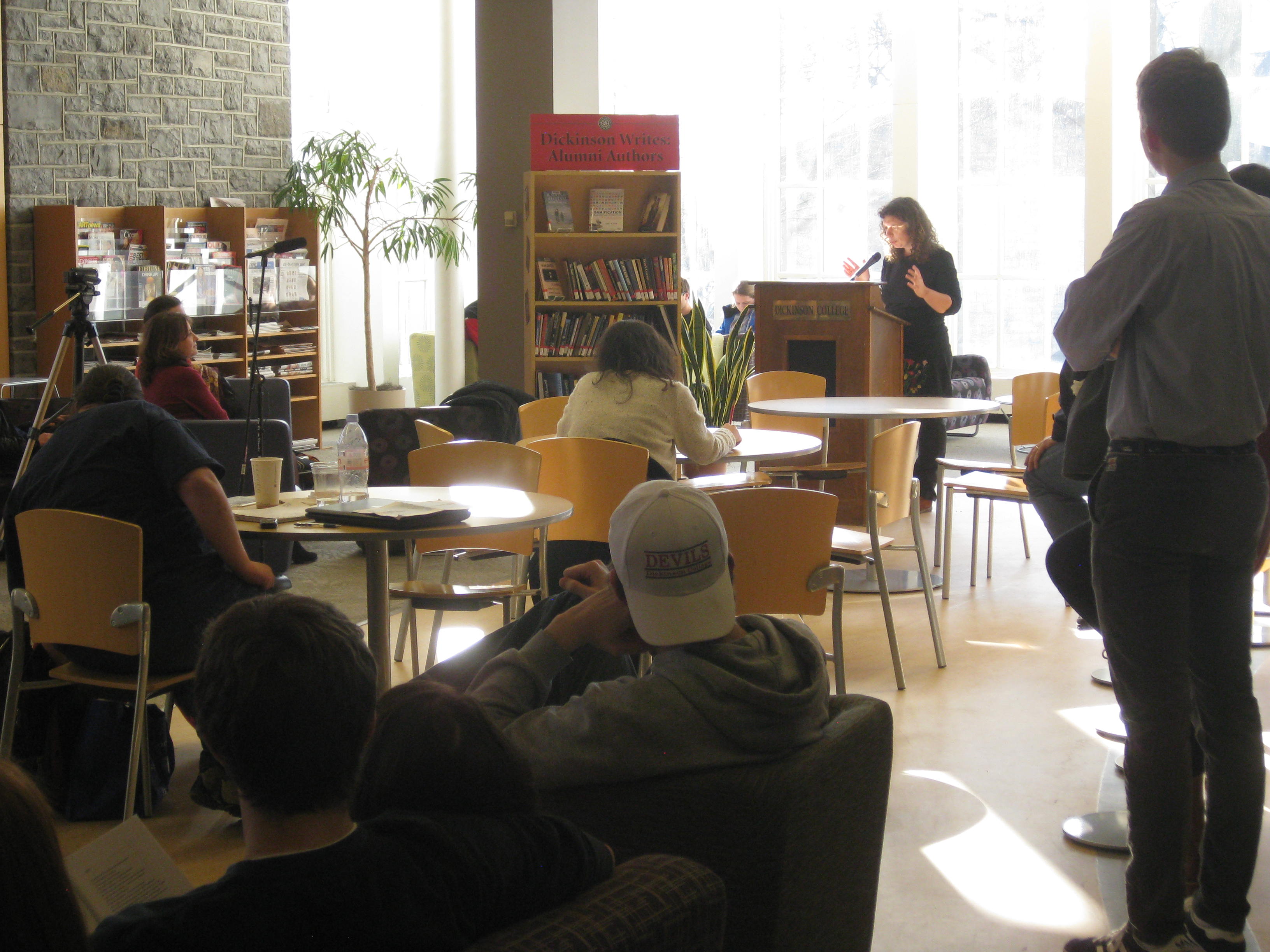 Photo of Russian poet Polina Barskova reading to students in the Biblio Café.