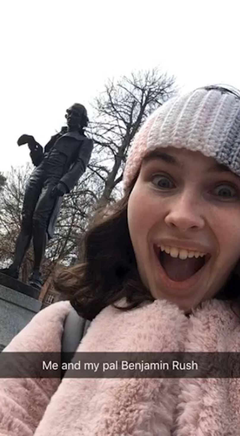 Olivia Riordan '21 and Benjamin Rush statue at Dickinson College
