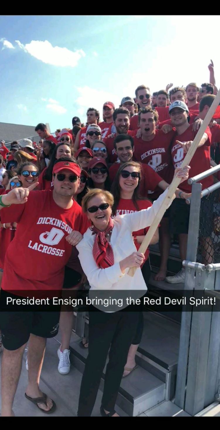 Dickinson College President Margee Ensign cheering on the Red Devils