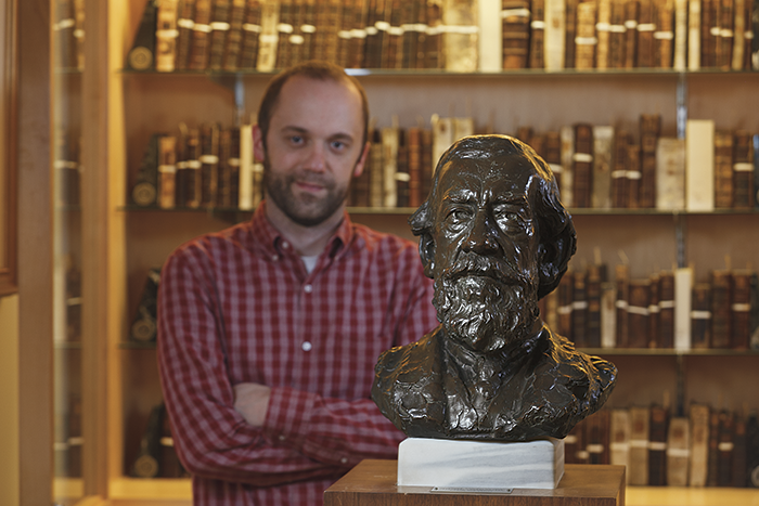 Don Sailer, library digital projects manager, with Dickinson’s bronze bust of Moncure Conway, class of 1849.