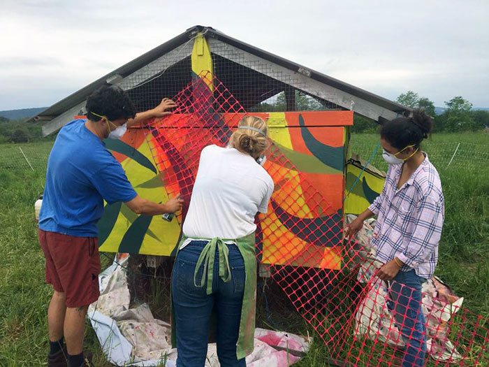 Student paint the chicken coop