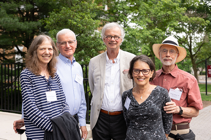Members of the class of '71, including President Emeritus William G. Durden, gather for an outdoor celebration. Photo by Dan Loh.