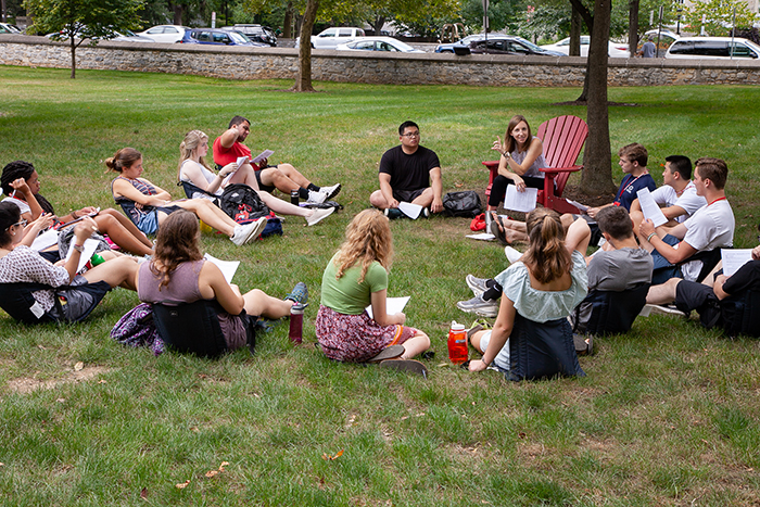 Students in a first-year seminar take advantage of a warm summery day during Orientation Week. Photo by Carl Socolow '77.