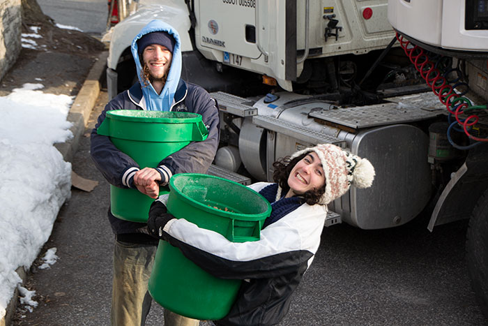 Student Farmers carry compost 