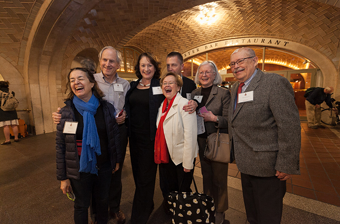Alumni pose with President Margee Ensign at the Grand Central Terminal in NYC. Photo by Carl Socolow '77.