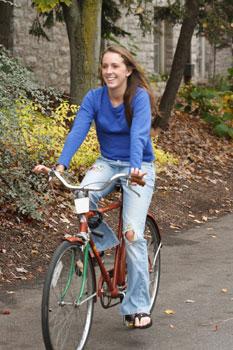 Student Morgan Abel riding one of Dickinson's Green Bikes.