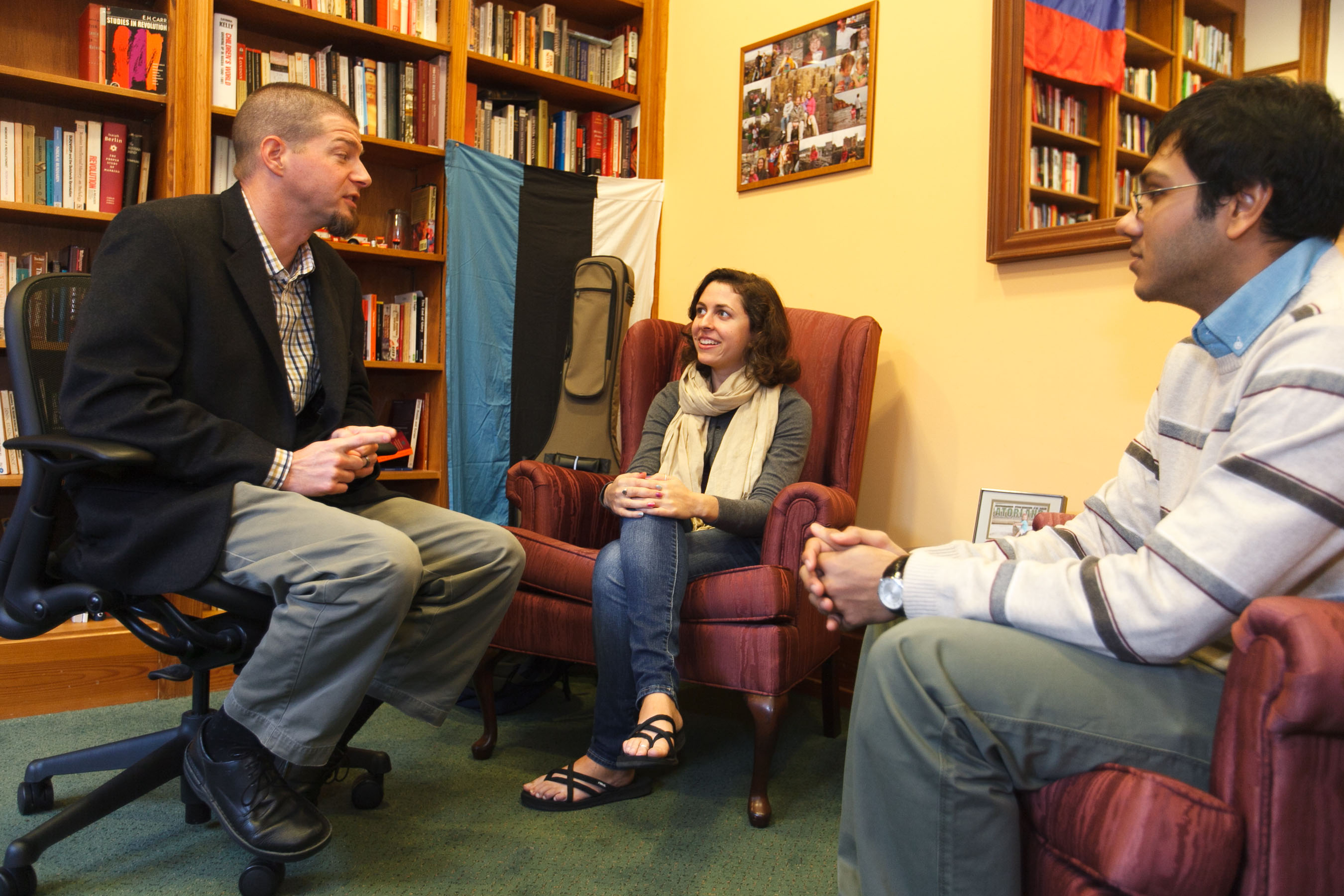 Professor with students in a library
