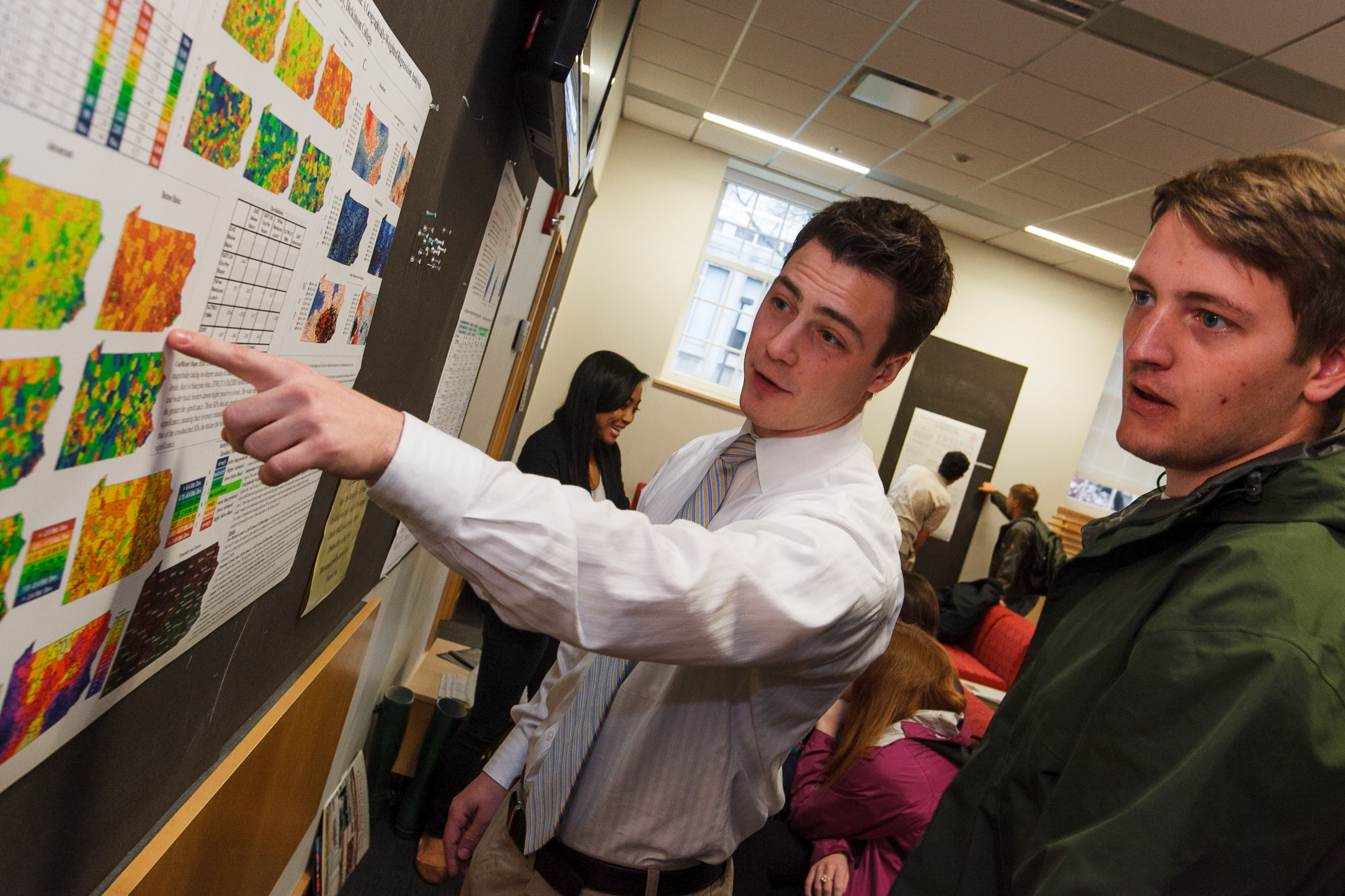 Student and professor at a poster session