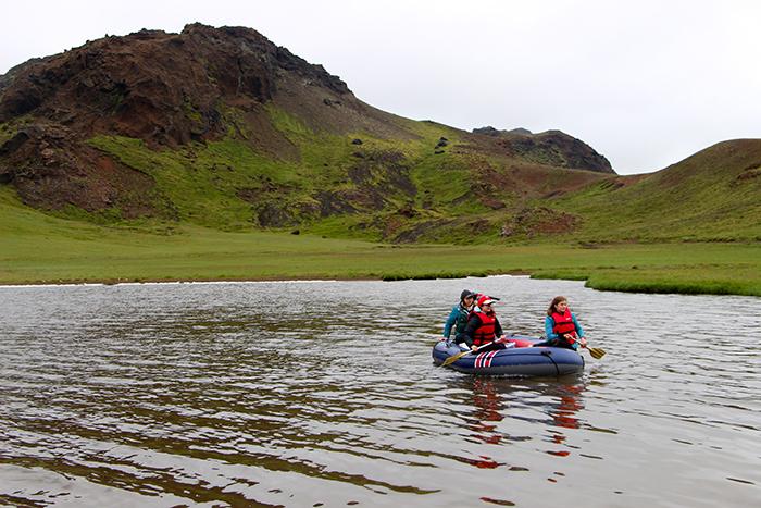 Dickinson College researchers travel in a small boat on an Icelandic lake.