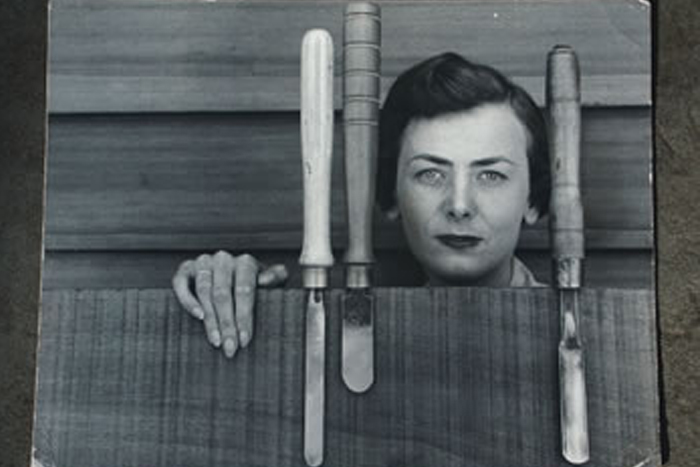 In 1956, Joyce Rinehart Anderson ’45 is depicted with some woodworking tools.