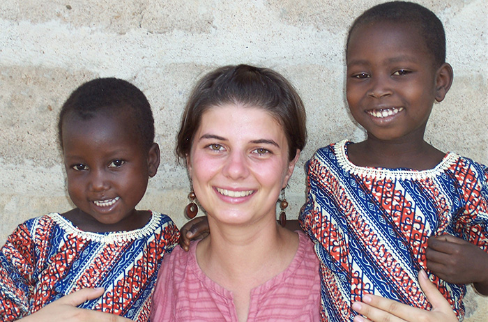 Maggie Murphy in Togo with two young neighbors.
