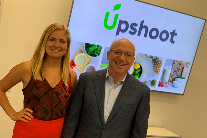 Kirsten Brodeen '20 poses with Mark '71 Lehman '71,  at Upshoot LLC, where she was an entrepreneurship intern this summer.