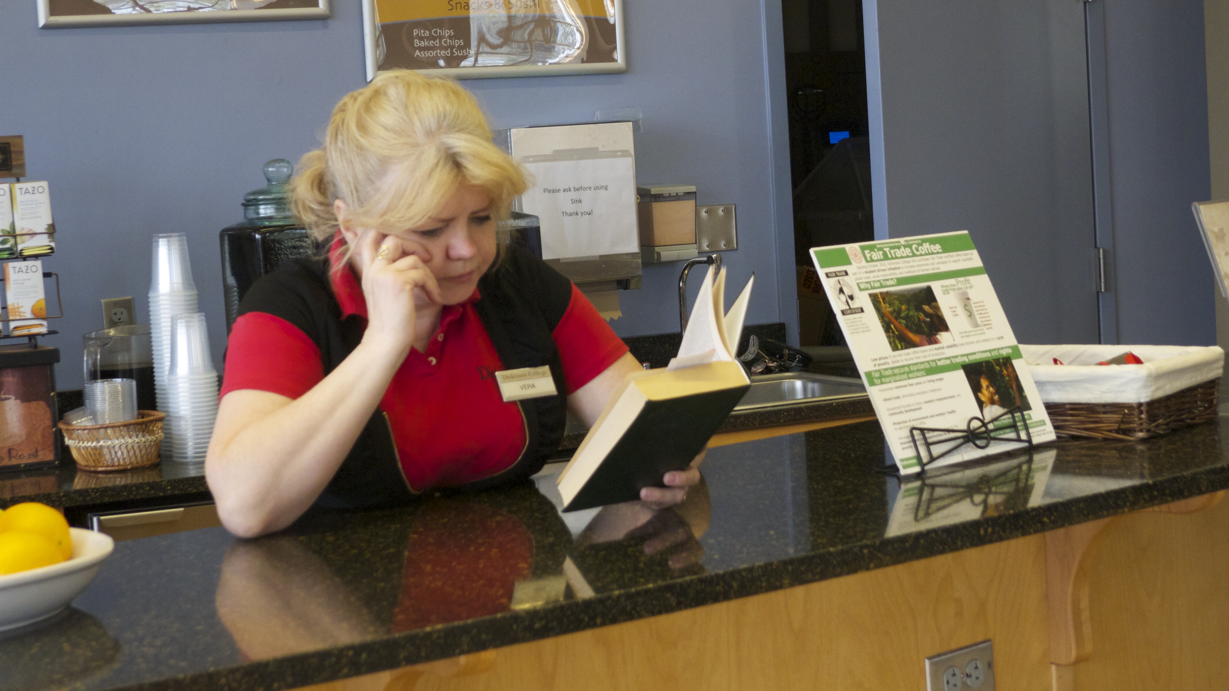A Dining Services employee brushes up on her Russian Don Quixote at the Biblio Café.