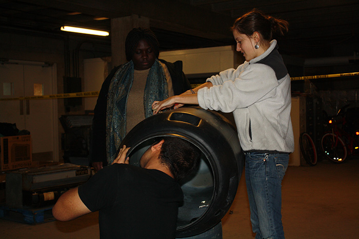 Students constructing a rain barrel