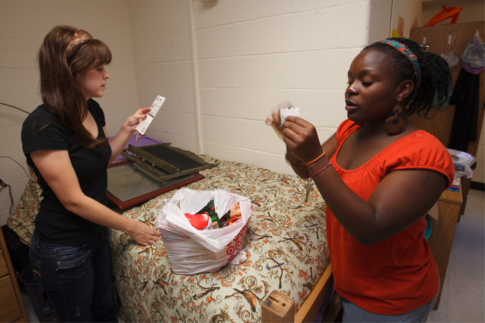 First-year roommates decorate their dorm room. 