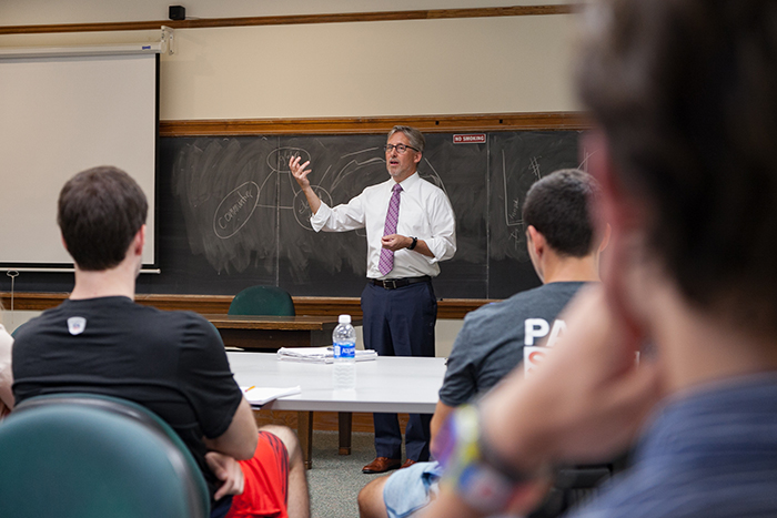 Brett Jenks, recipient of the 2017 Rose-Walters Prize for Global Environmental Activism, works with students in Professor of Political Science Jim Hoefler's senior seminar. Photo by Carl Socolow '77.