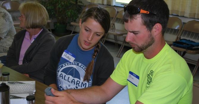 Ruby training a volunteer at a Shale Gas Monitoring training.