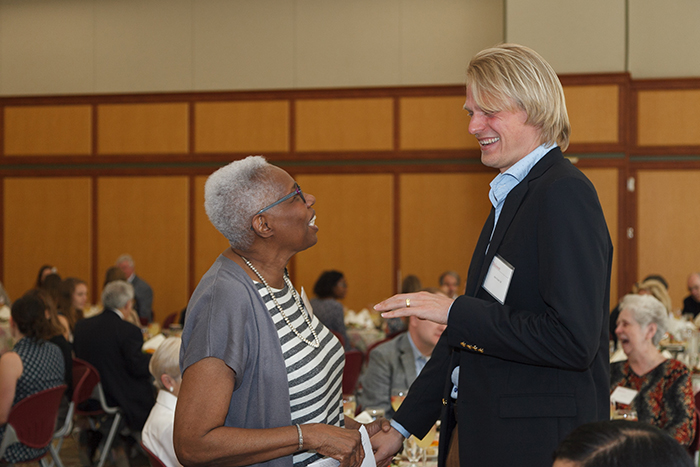 Froom greets Dean Joyce Bylander during the 2018 Scholarship Luncheon. Photo by Carl Socolow '77.