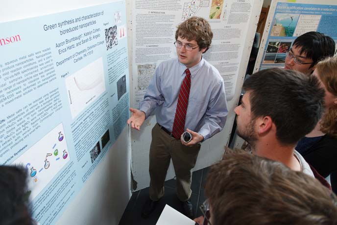 Aaron Brumbaugh explains original research during the 2013 Science Student Symposium.