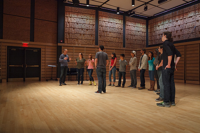 Tenor Markus Zapp (far left) of Singer Pur works with members of a student a cappella group during a masterclass on vocal technique.