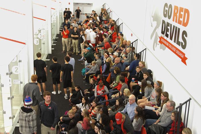 huge crowd watches home squash match