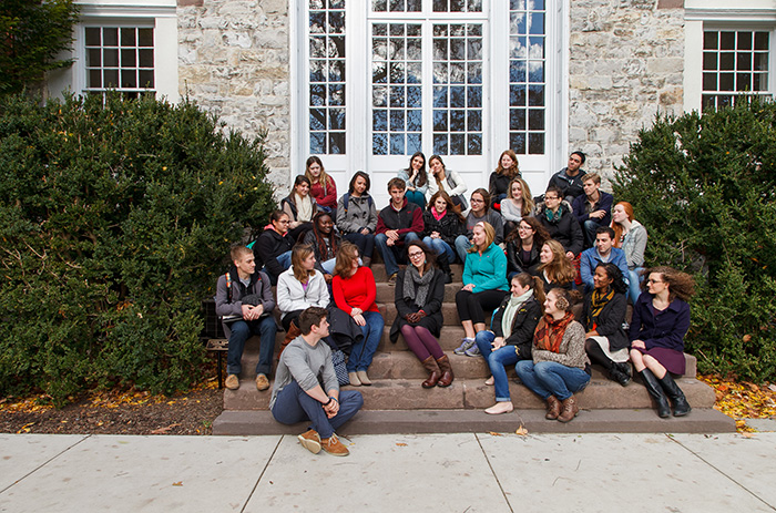 Lorrie Moore poses with students on the steps of Old West, the traditional Stellfox photo.