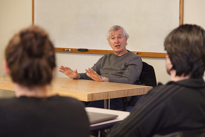 John Patrick Shanley speaks with students in a theatre class. Photo by Carl Socolow '77.
