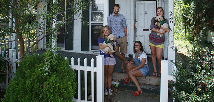 Students help the community by raising service dogs.