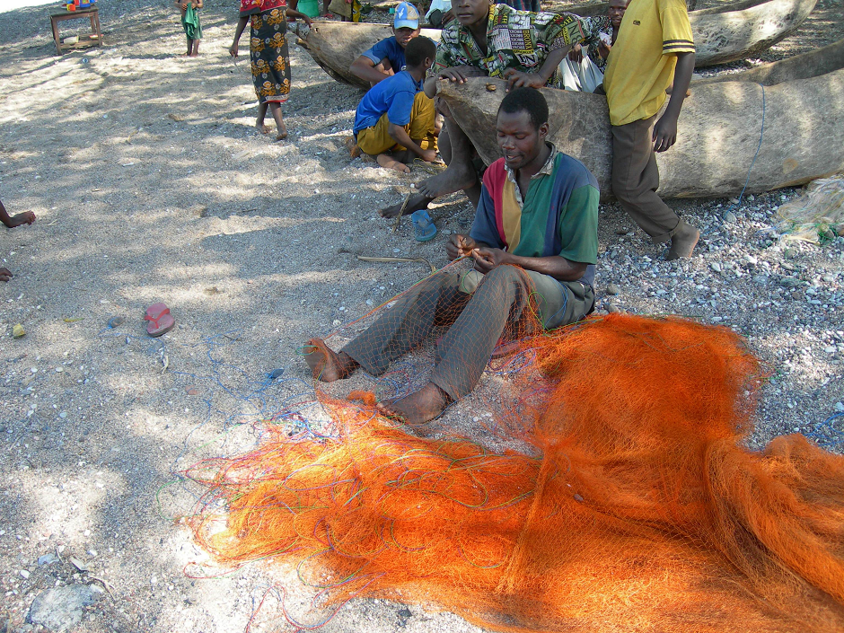 Photograph of Tanzania fishermen mending the nets 