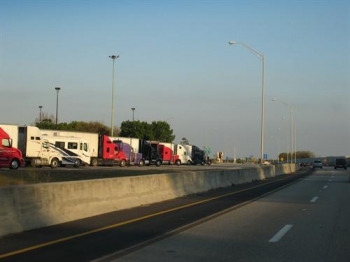 Photograph of I-81 with trucks at rest stop