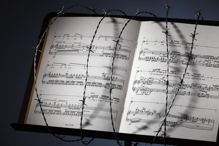 Sheet music in barb wire