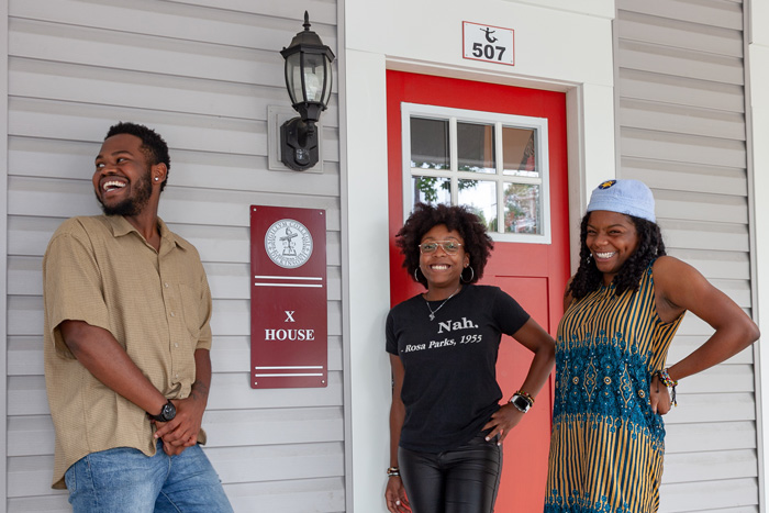 Quadrese Glass '19, Janaiya Banks '19 and Naji Thompson '19 pose in front of the special-interest house they co-founded. Five students are living in X House this semester. Photo by Carl Socolow ’77.