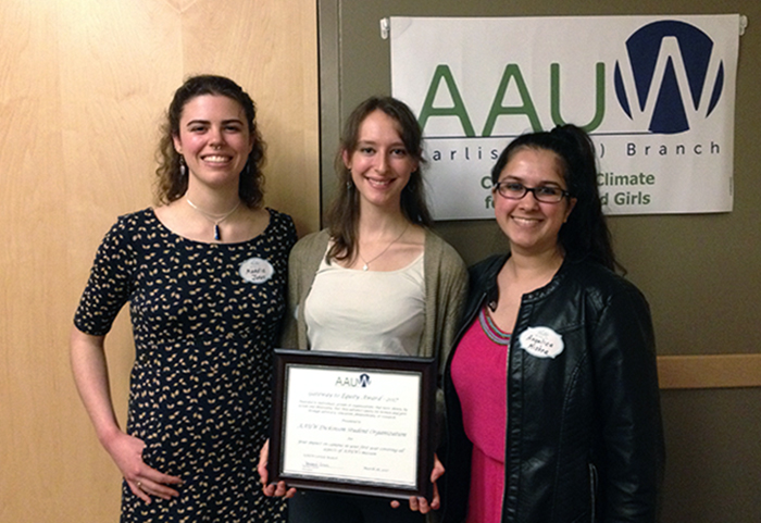 Officers of the Dickinson College AAUW accept an award during a March 28 ceremony. From left: Maddie Jones ’19, vice president; Margot Abrahams ’17, president; and Angelica Mishra 19, secretary.