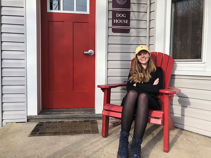 Abbie Cottle '20, in front of Dickinson's Dog House, where students train service animals.