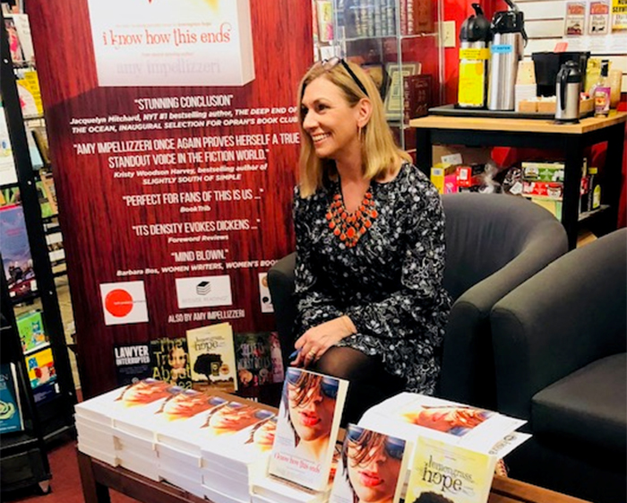 Novelist Amy Shelley Impellizzeri '92 at a book signing for her most recent work, "I Know How This Ends."