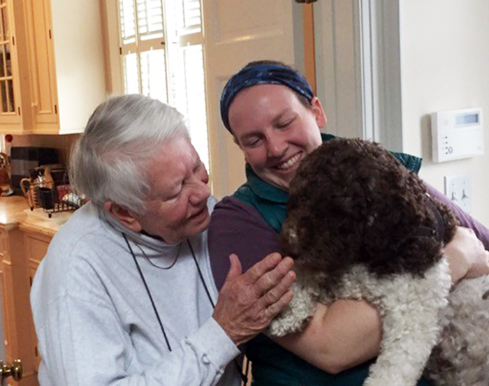 Betty Churchill '58 (left) visits with Anna McGinn  and Anna's dog, Sparrow.