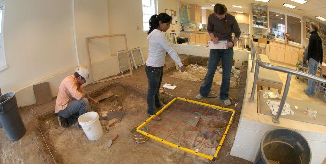 Students working on the dig simulator of the Keck Archaeology Lab