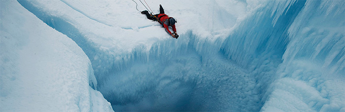 photo of James Balog diving into glacier