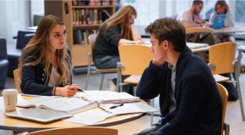 Students studying at tables in the Biblio Café