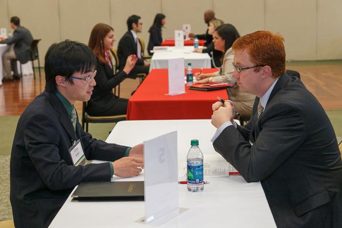 A student talking with a Dickinson alumnus at a networking event.