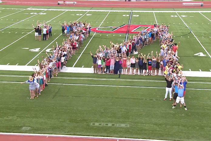 A group shot of class of 2014 Dickinson students spelling out '14.