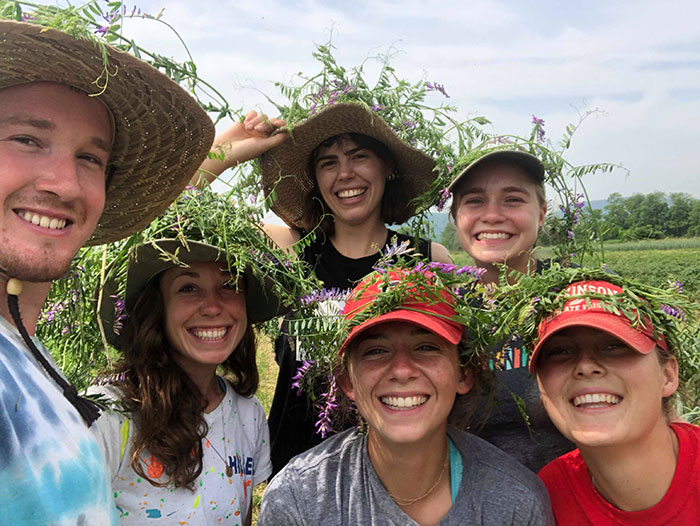 Student Farmers with leaves in their hats.