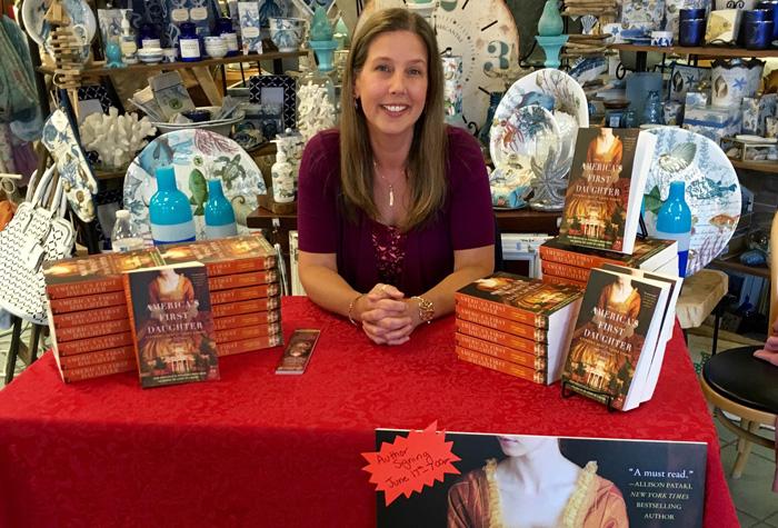 Laura Kamoie at a book signing event