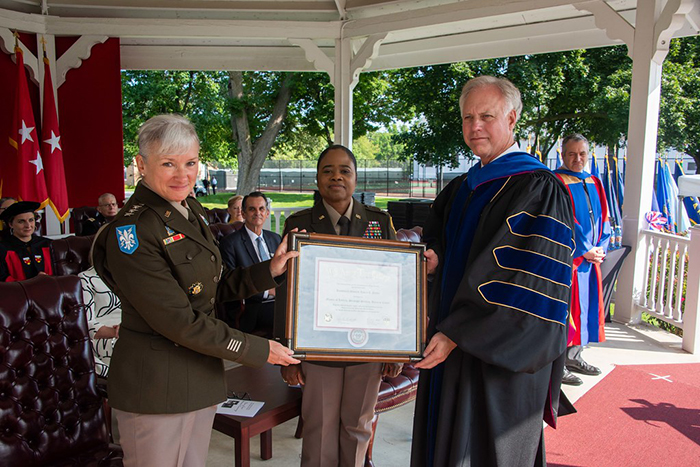 Lt. Gen. Laura Potter (left) accepts an honorary degree from the USAWC. Also pictured: Brig. Gen. Janeen Brickhead (center)  and James Breckenridge, USAWC provost. Photo courtesy of the USAWC Photo Lab.